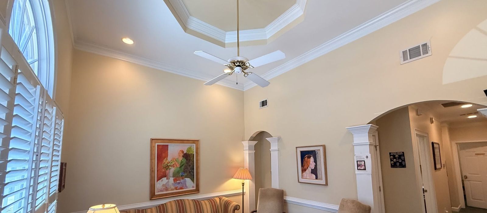 Office interior with a tray ceiling and reception seating